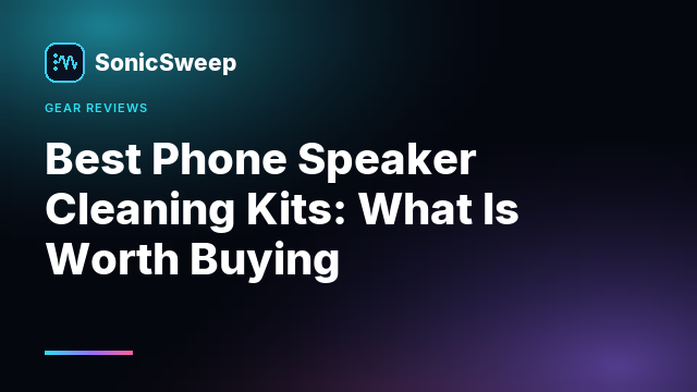 A soft brush, a microfibre cloth and a rubber bulb blower laid out beside a phone